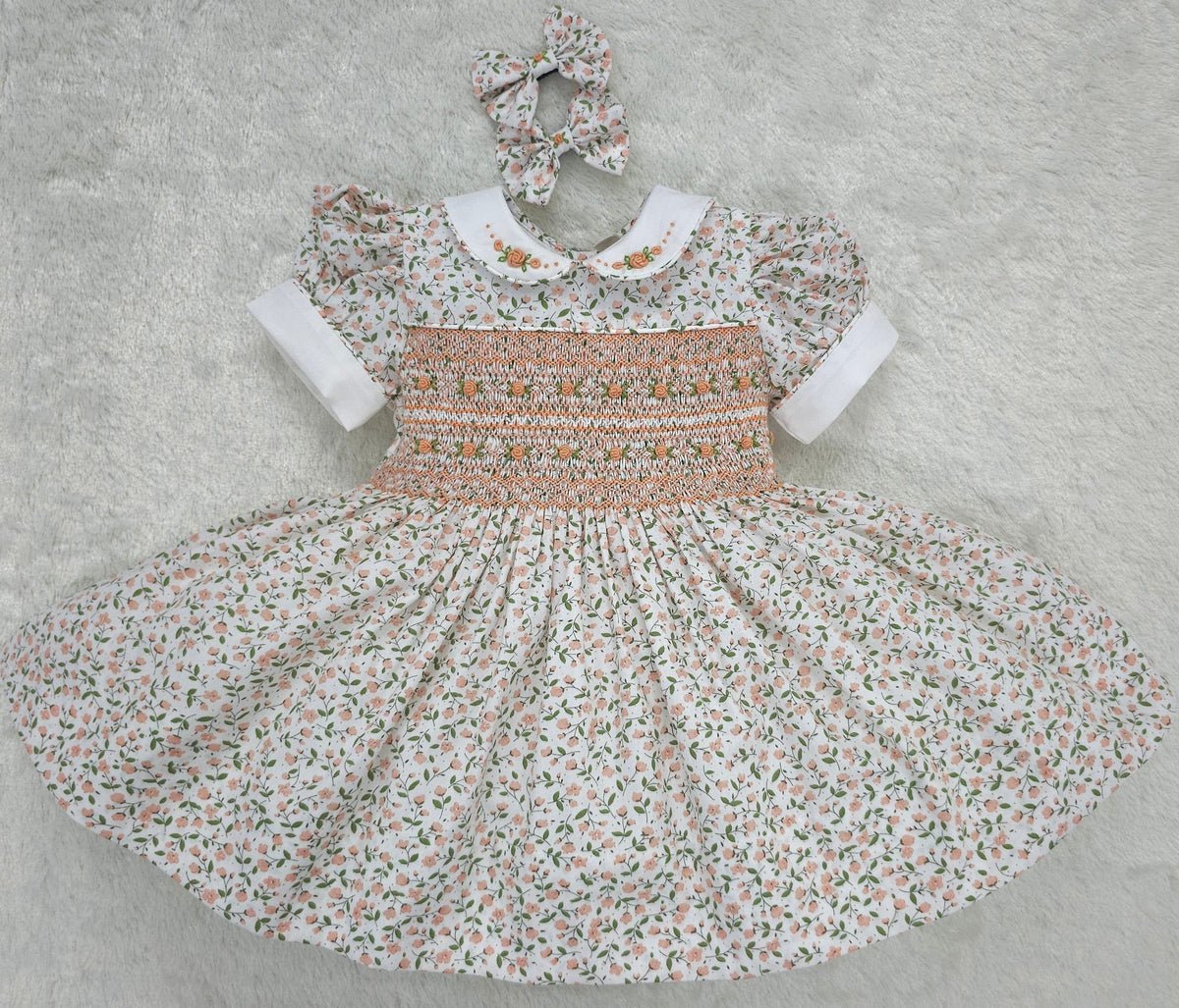 Floral smocked dress with peach embroidered flowers