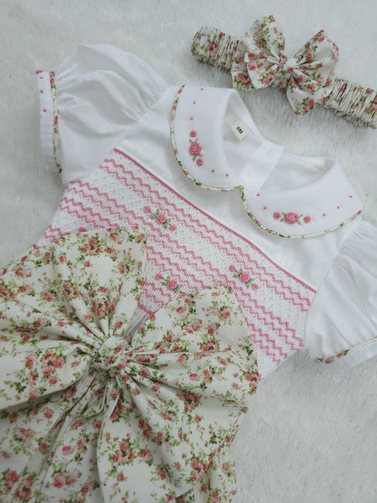 Pink floral hand smocked girls romper