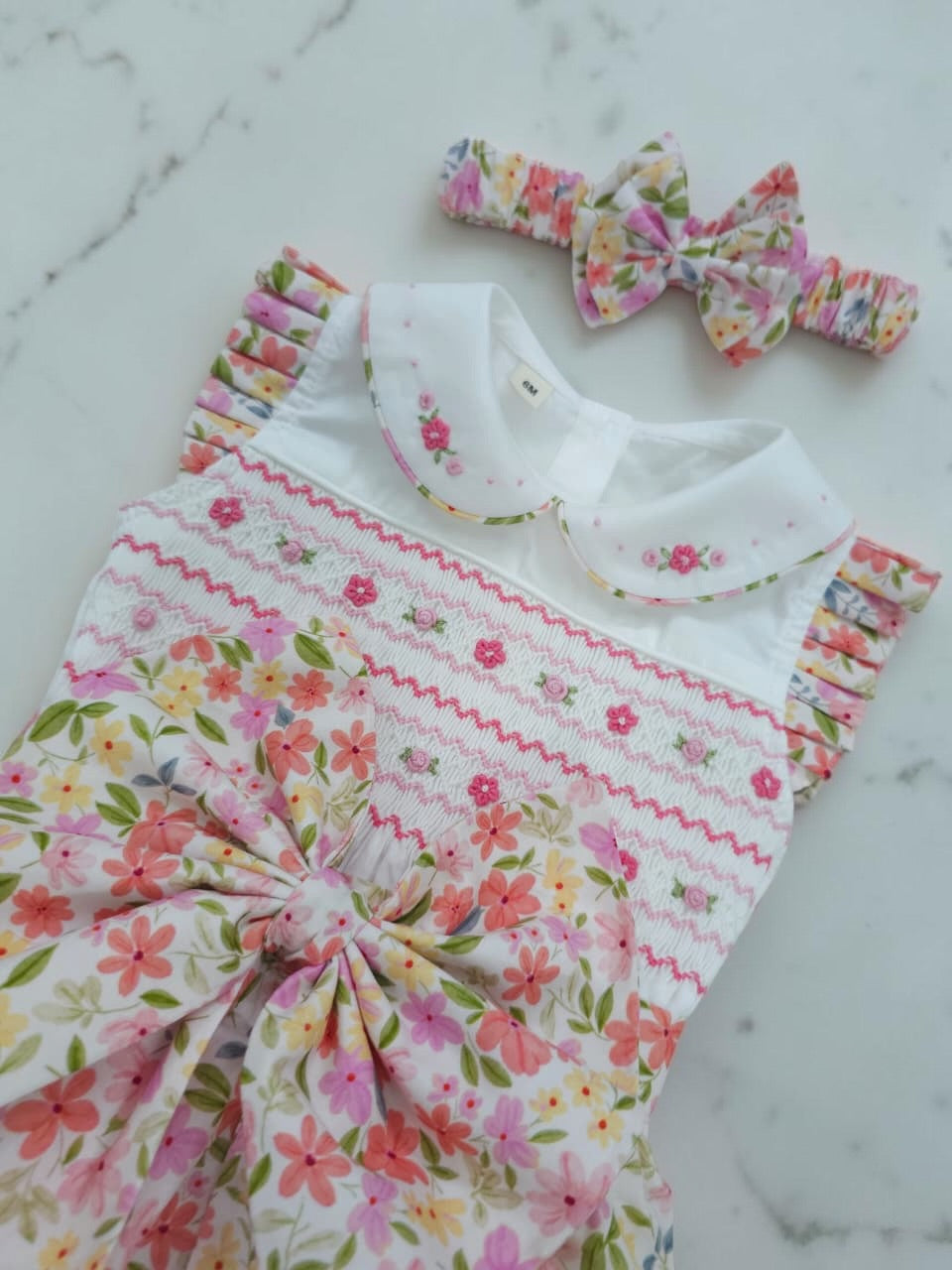 Floral sleeveless hand smocked romper