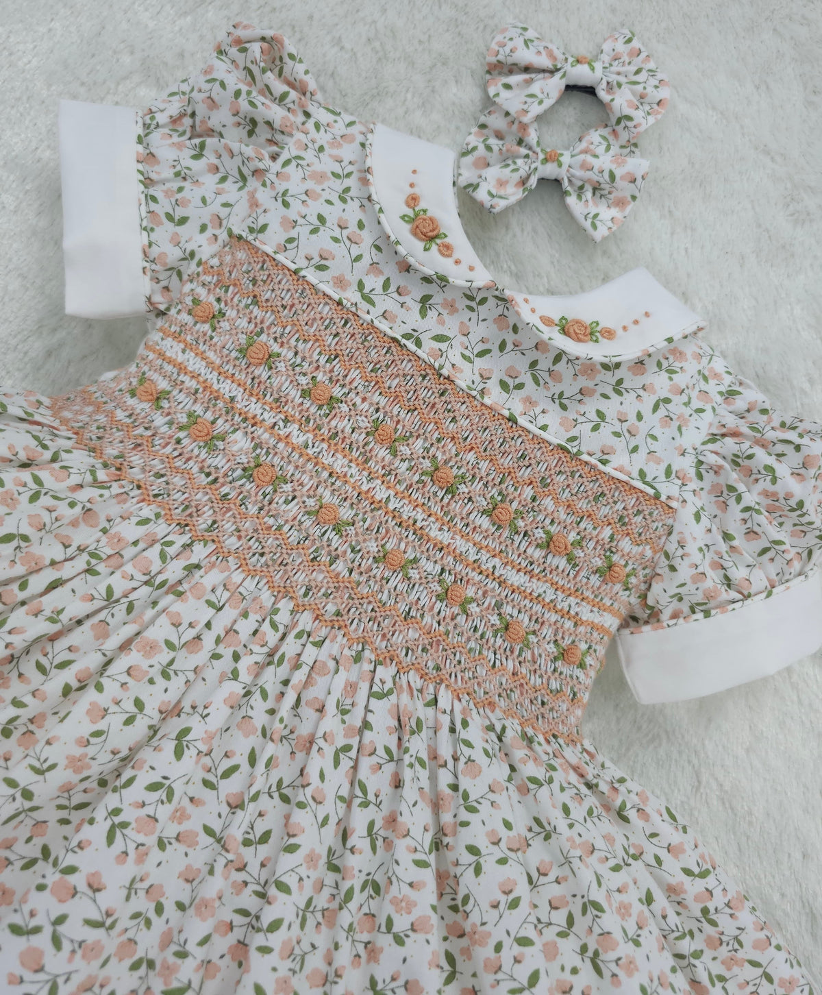 Floral smocked dress with peach embroidered flowers